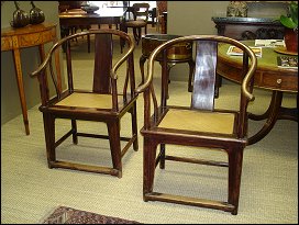 A pair of Chinese horseshoe back chairs