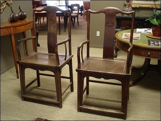 A pair of Qing period elm  yoke back armchairs